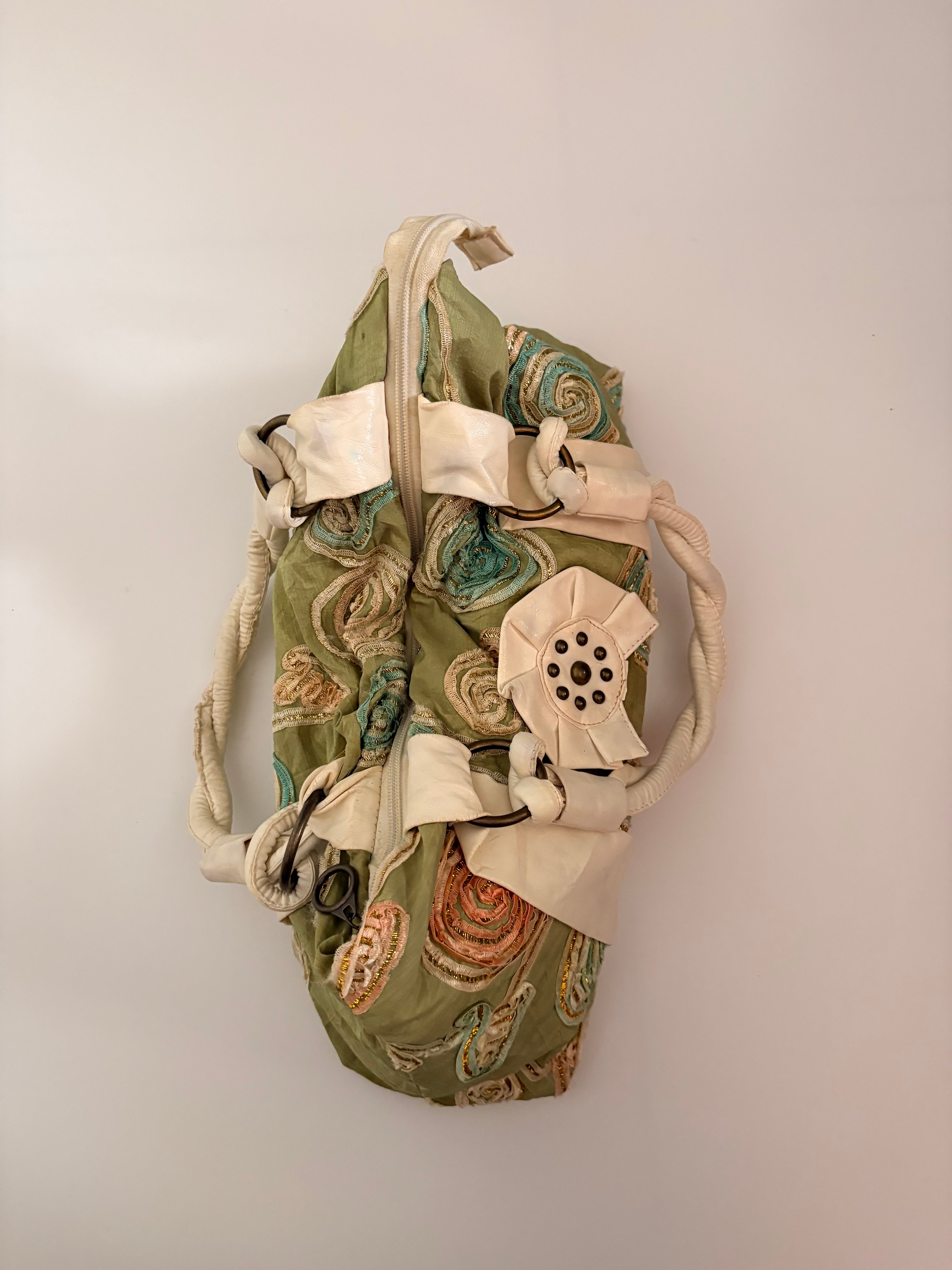green embroidered bag